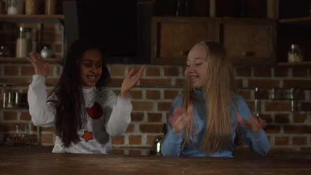 Smiling little girls having fun in the kitchen — Stock Video