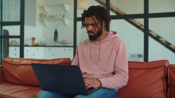 Creative black freelancer with laptop working on project — Stock Video