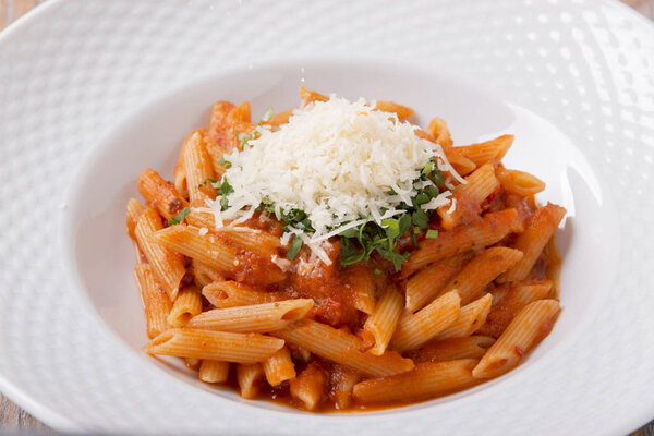 pasta penne with parmesan cheese tomato sauce greens