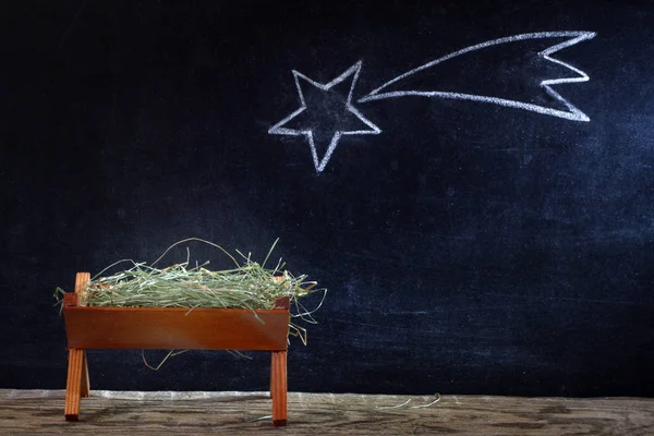 Jesu födelse med krubban och stjärna på blackboard abstrakt julen julkrubba — Stockfoto