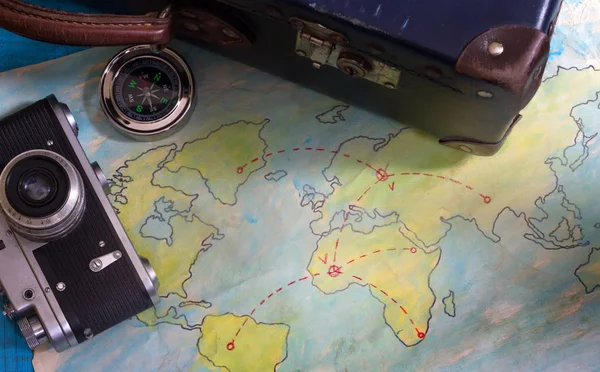Travel plan abstract concept with old maps suitcase and camera