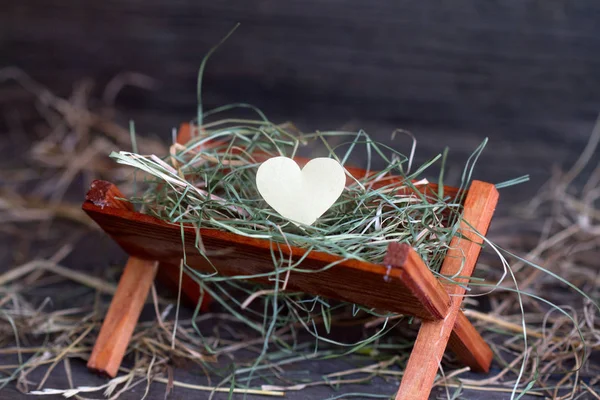 Manger Jezus en het hart van liefde abstracte kerst symbool — Stockfoto