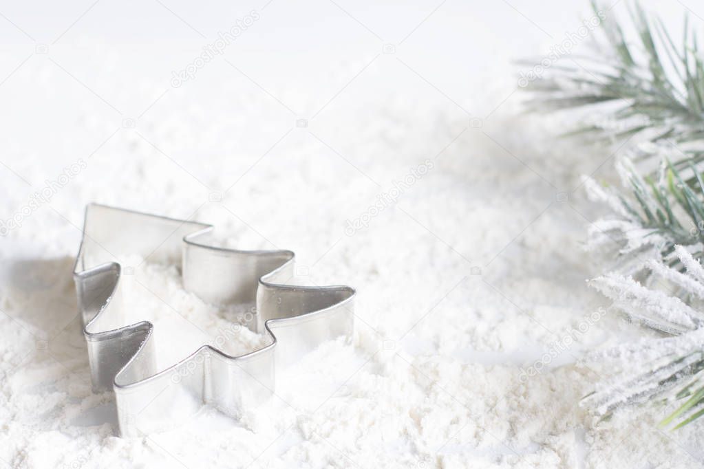 Christmas food concept with a tree cake mold on white background