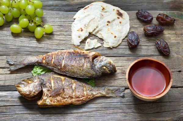 Easter ancient food with fish passover bread and goblet of wine last supper concept — Stock Image Easter Ancient Food Fish Passover Bread Goblet Wine Last Supper Stock Image