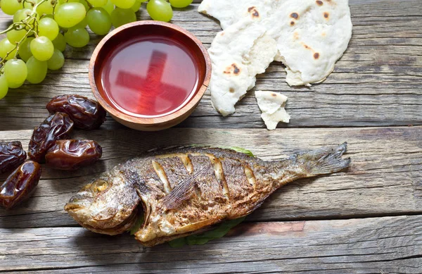 Easter food with fish passover bread cross in goblet of wine last supper abstract — Stock Image Easter Food Fish Passover Bread Cross Goblet Wine Last Supper Royalty Free Stock Images