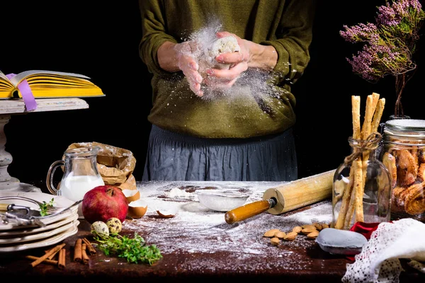 Partial view of human hands preparing dough at table with ingredients — Stock Photo