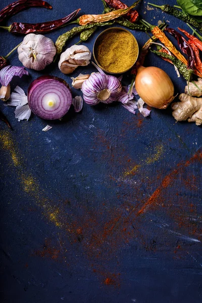 Top view of various spices on blue background — Stock Photo