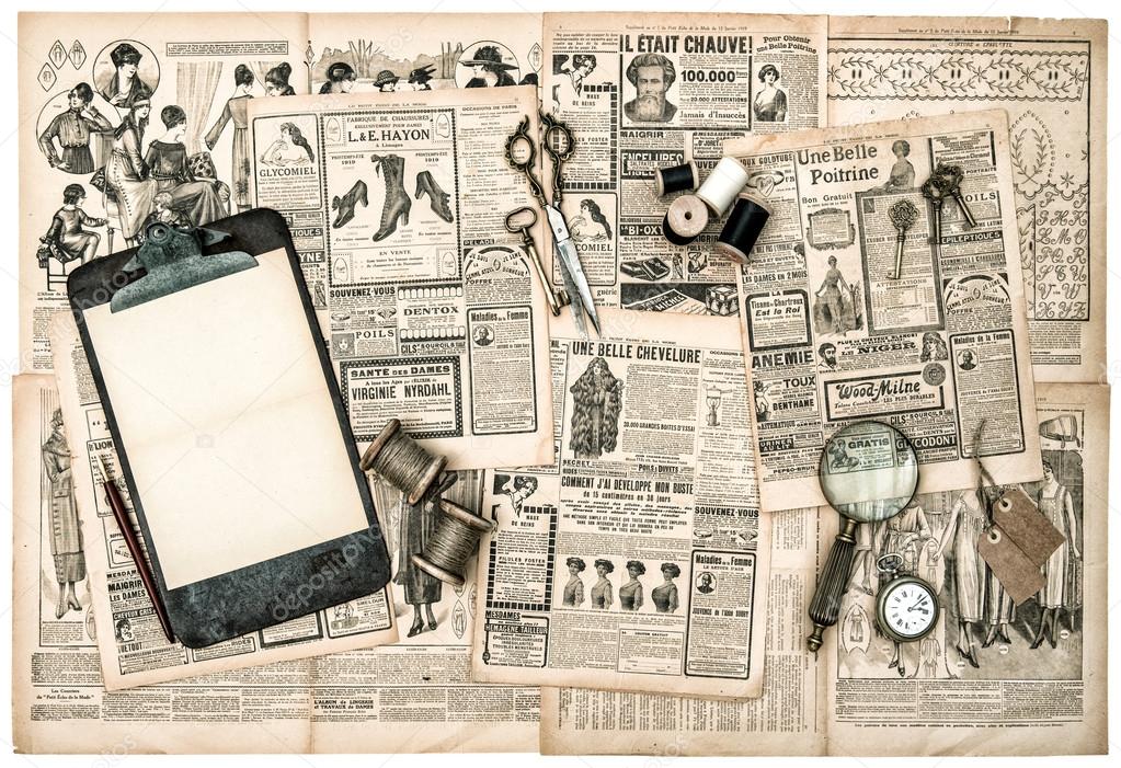 Antique accessories on newspaper pages