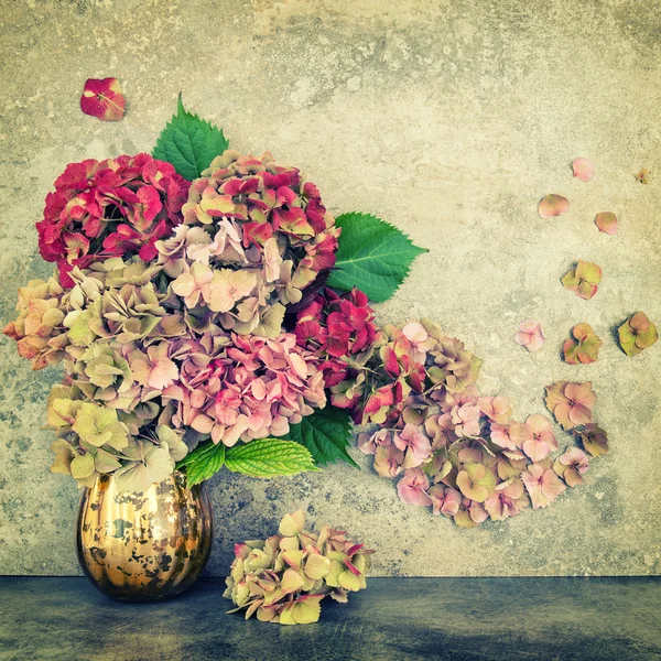 Hortensia flowers bouquet stone background vintage toned — Stock Photo, Image