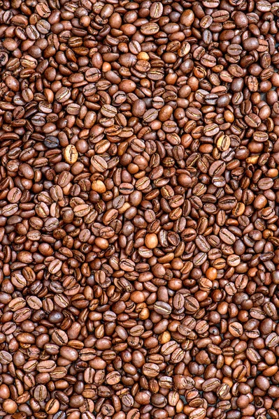 Hnědé fazole káva pozadí textury — Stock fotografie