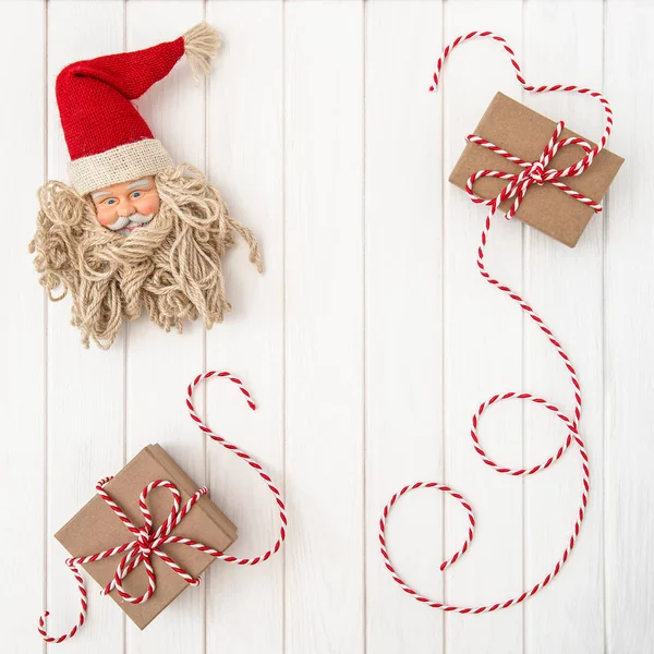 Christmas decoration with gift box and Santa Claus — Stock Photo, Image