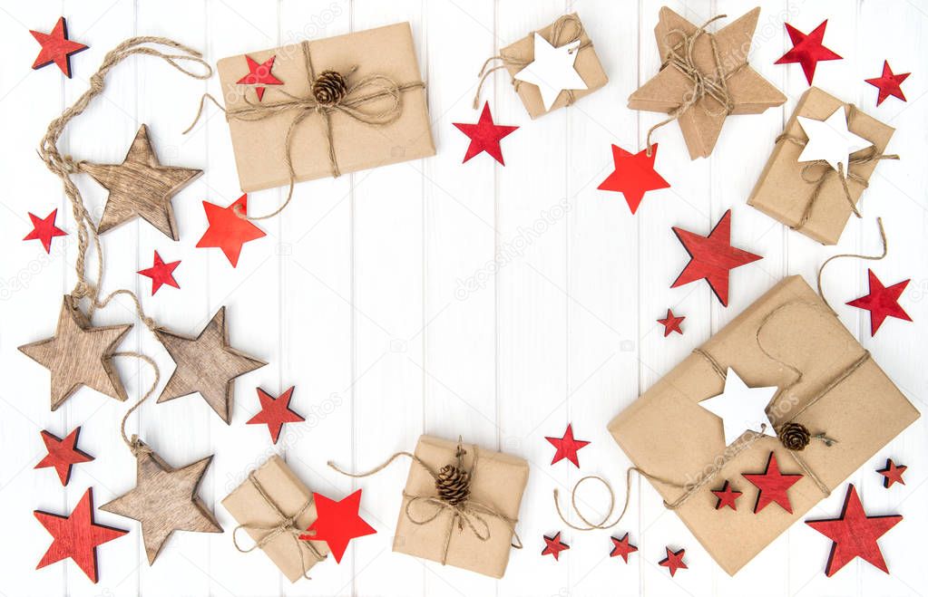 Wrapped gifts with christmas decoration red stars Flat lay