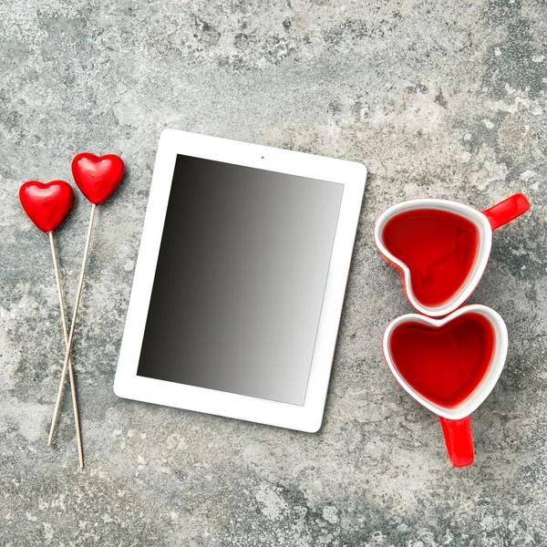 Tablet PC with red hearts — Stock Photo, Image