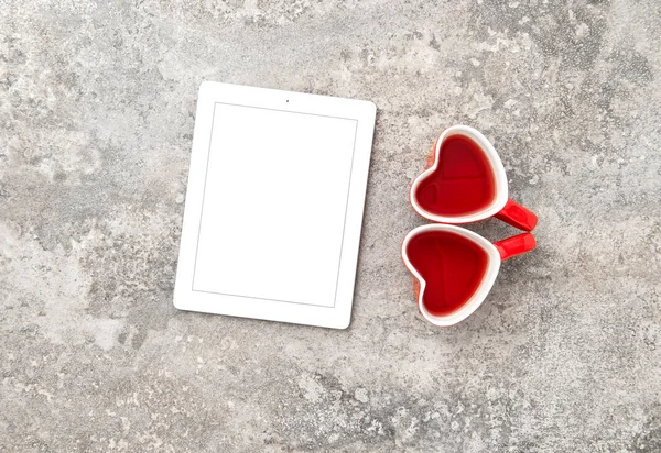 Tablet PC with Red Heart Tea Cups — Stock Photo, Image