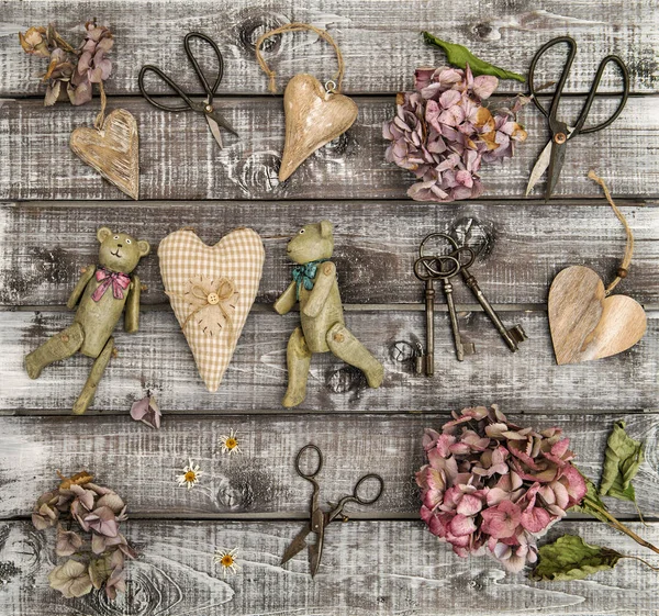 Vintage toys hortensia flowers wooden hearts flat lay — Stock Photo, Image