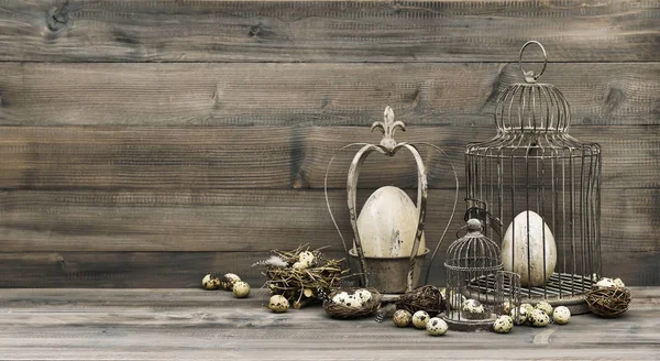 Easter decoration eggs nest birdcage vintage toned — Stock Photo, Image