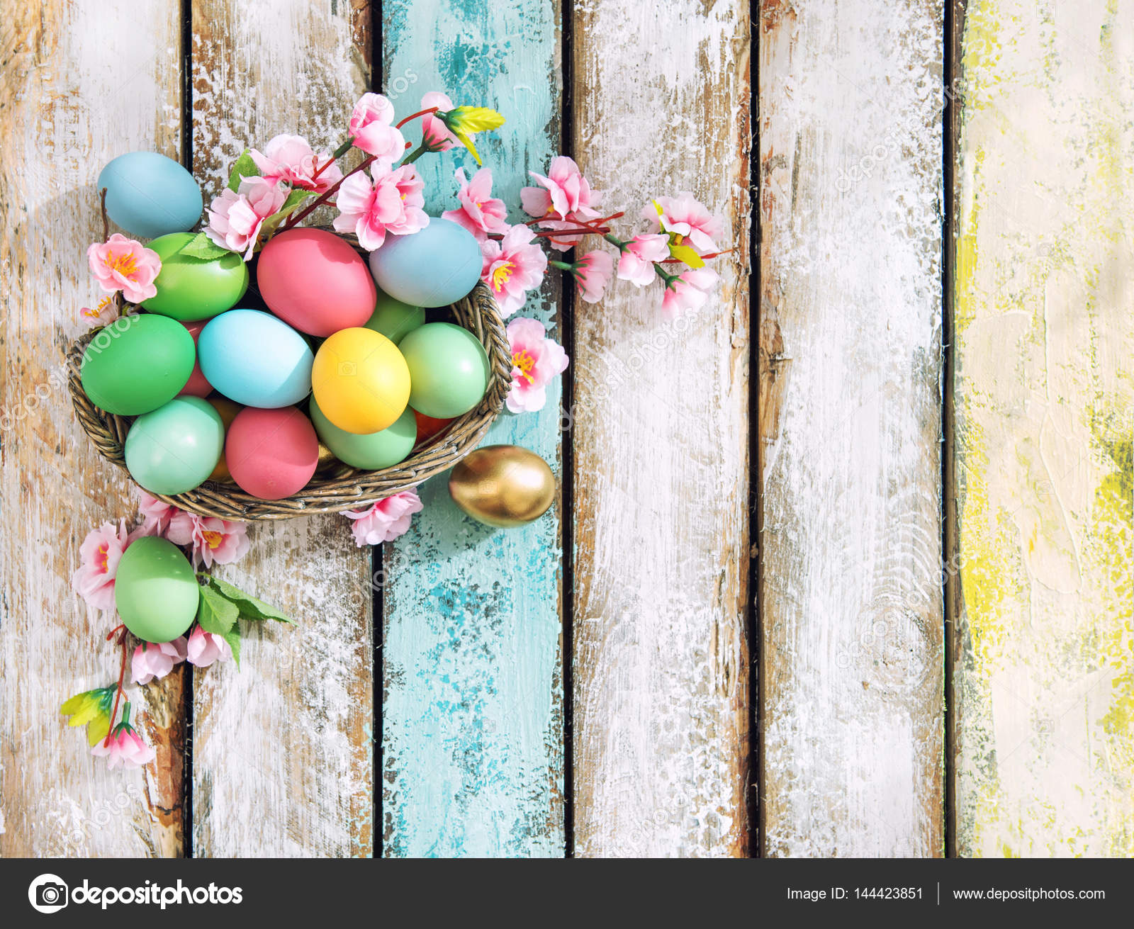 Easter eggs flower decoration vibrant vintage toned Stock Photo by