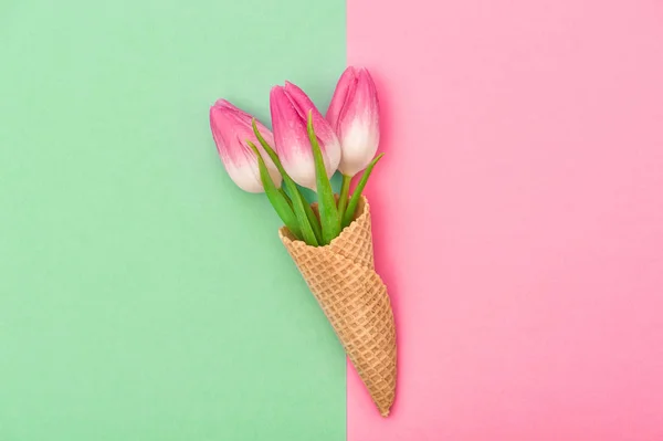 Tulip flowers ice cream waffle cone flat lay Spring — Stock Photo, Image