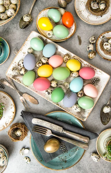 Festive table decoration colored Easter eggs — Stock Photo, Image