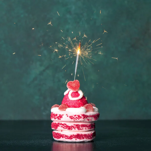 Sweet cake sparkler decoration dark background — Stock Photo, Image