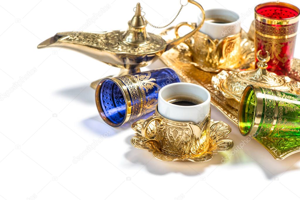 Golden coffee cups tea glasses white background Arabic lantern