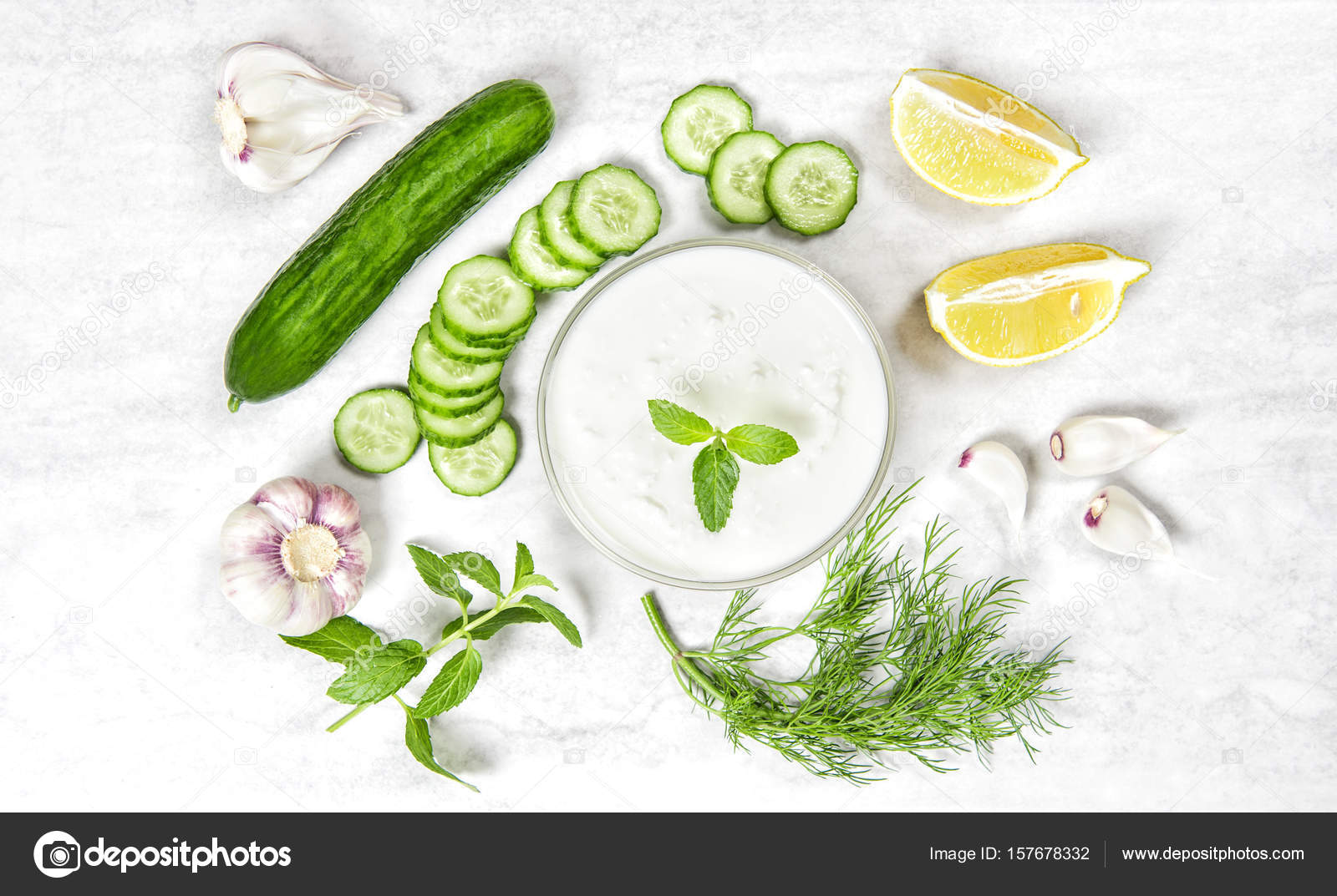 Tzatziki sauce ingredients Yoghurt mint dill herbs cucumber Stock Photo