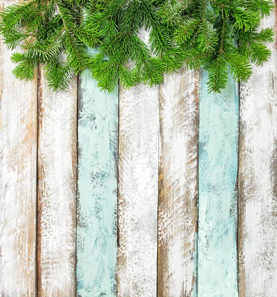 Christmas tree branches colored rustic wooden background — Stock Photo, Image