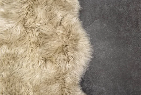 Sheep fur Sheepskin rug background stone texture — Stock Photo, Image