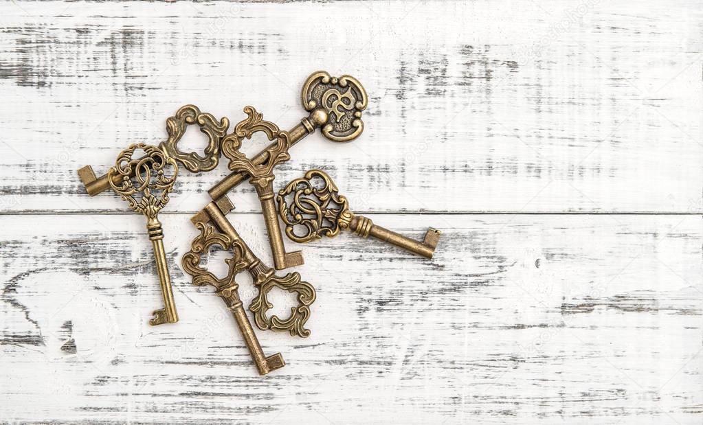 Antique keys rustic wooden background Nostalgic still life