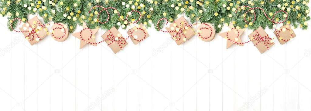 Christmas tree branches gift box golden lights holidays banner