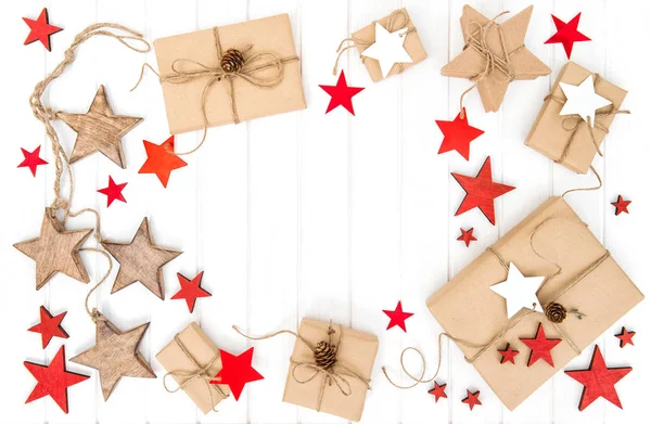 Holidays flat lay Wrapped gifts red stars decoration — Stock Photo, Image