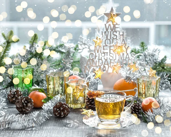 Cup tea Christmas decoration Winter golden lights — Stock Photo, Image