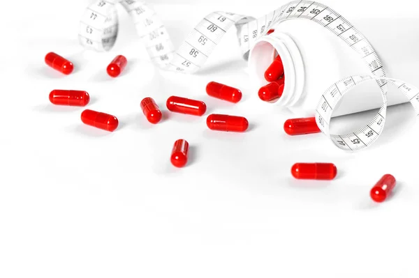 Píldoras de pérdida de peso cinta métrica dieta salud desintoxicación —  Fotos de Stock