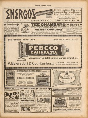 Kullanılmış kağıt arka plan. Eski gazete sayfalarında klasik reklamlar var.