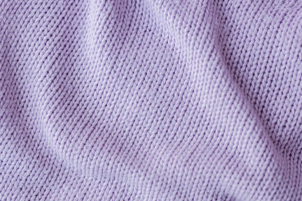 Lilac knitting wool texture background.