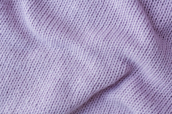 Lilac knitting wool texture background.