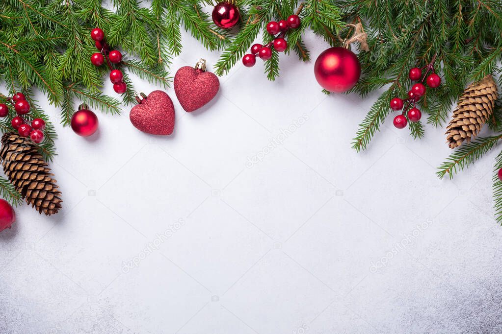 Christmas background with fir tree and red gifts. Top view Copy space