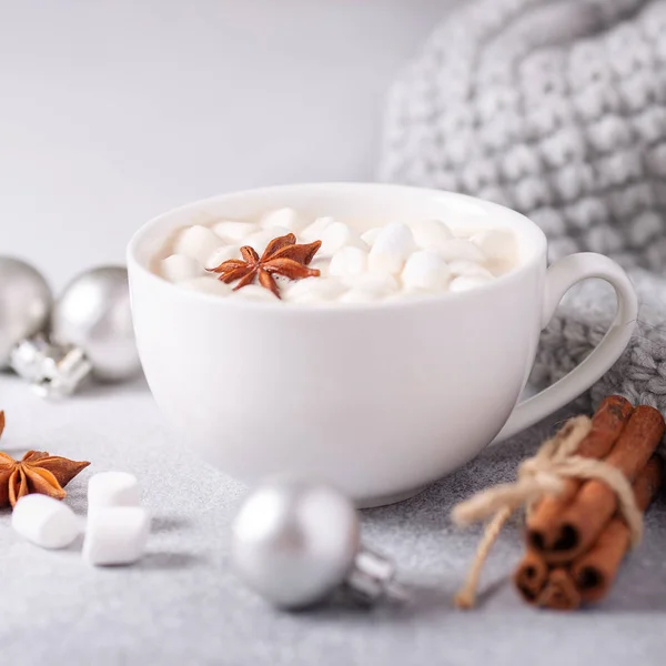 White cup with coffee and marshmallow, sweater, cinnamon. Cozy christmas composition. Hygge concept Soft focus — Stock Photo, Image