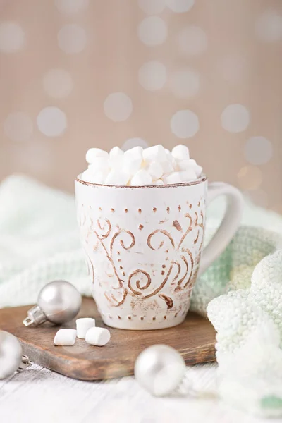 Mug with coffee and marshmallow, sweater, cinnamon. Cozy christmas composition. Hygge concept Soft focus — Stock Photo, Image