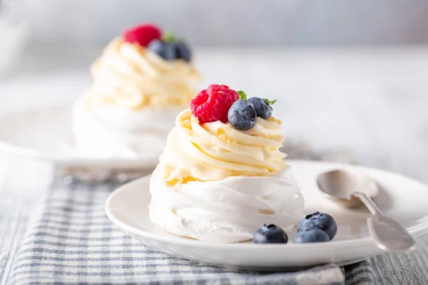 Delicious Pavlova cake with whipped cream and fresh berries. Close-up. Selective focus