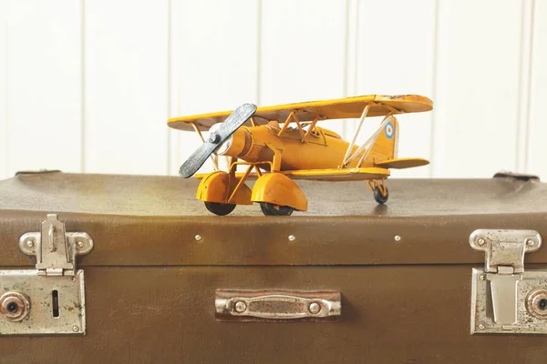 Toy Yellow Metal Plane Old Retro Suitcases White Wooden Background — Stock Photo, Image