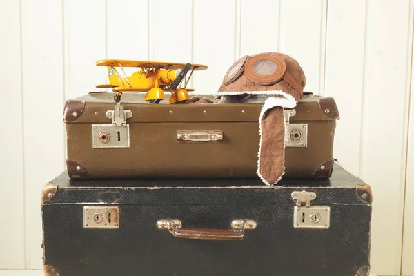Helmet Pilot Toy Yellow Metal Plane Two Old Retro Suitcases — Stock Photo, Image