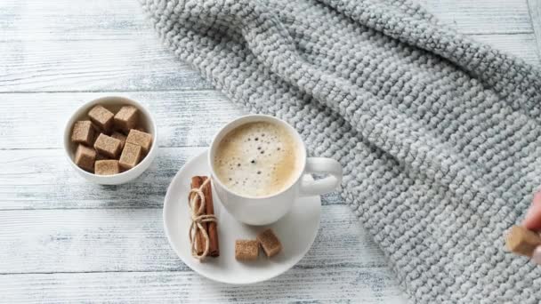 Female Hand Puts Piece Brown Sugar Mug Coffee Cozy Autumn — Stock Video