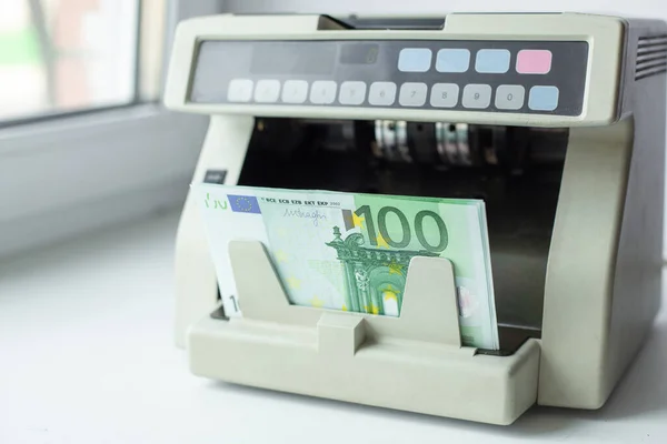 Euro currency on money counting machine. Automatic money counting in the machine - Image