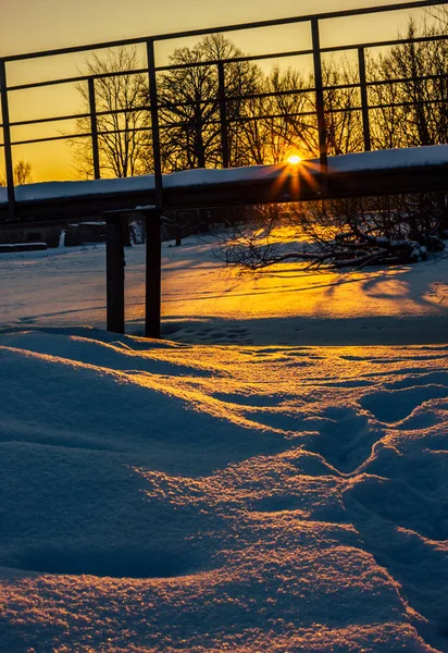 Snowy Bridge in a Countryside with the Sun Rays Gloving over it Directly into the Camera - Creating Sun Star