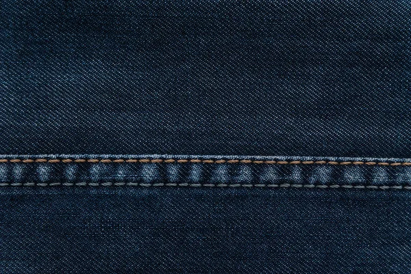 Texture of denim and seam on jeans. — Stock Photo, Image