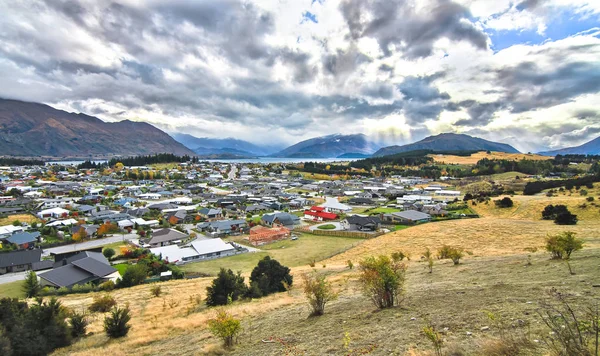 The town of Wanaka on New Zealand\'s south island, next to Lake Wanaka, with the Matukituki Valley in the distance. Photographed from Iron Mountain