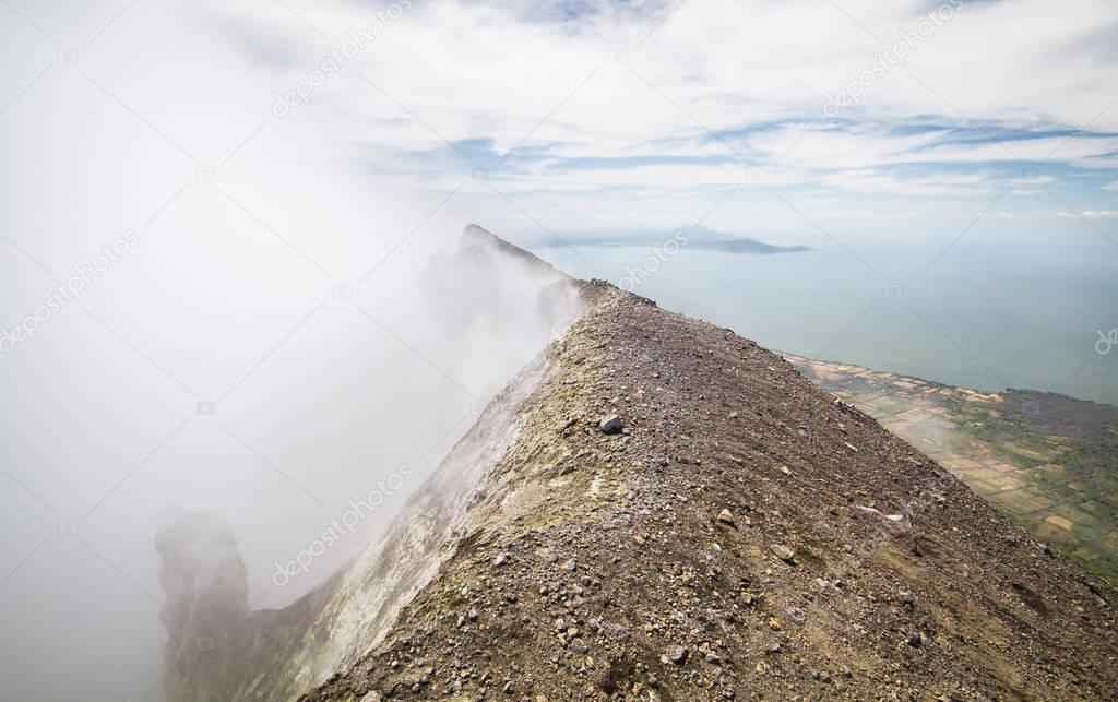 Gases and fumes spew out of Volcan Concepcion on the island of Ometepe, Nicaragua. Photograph was taken at the summit, looking north
