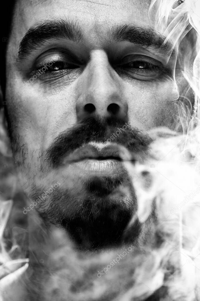 black and white portrait of a man in a haze or fog close up
