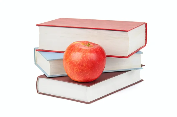 Libri e mela isolati su sfondo bianco — Foto Stock